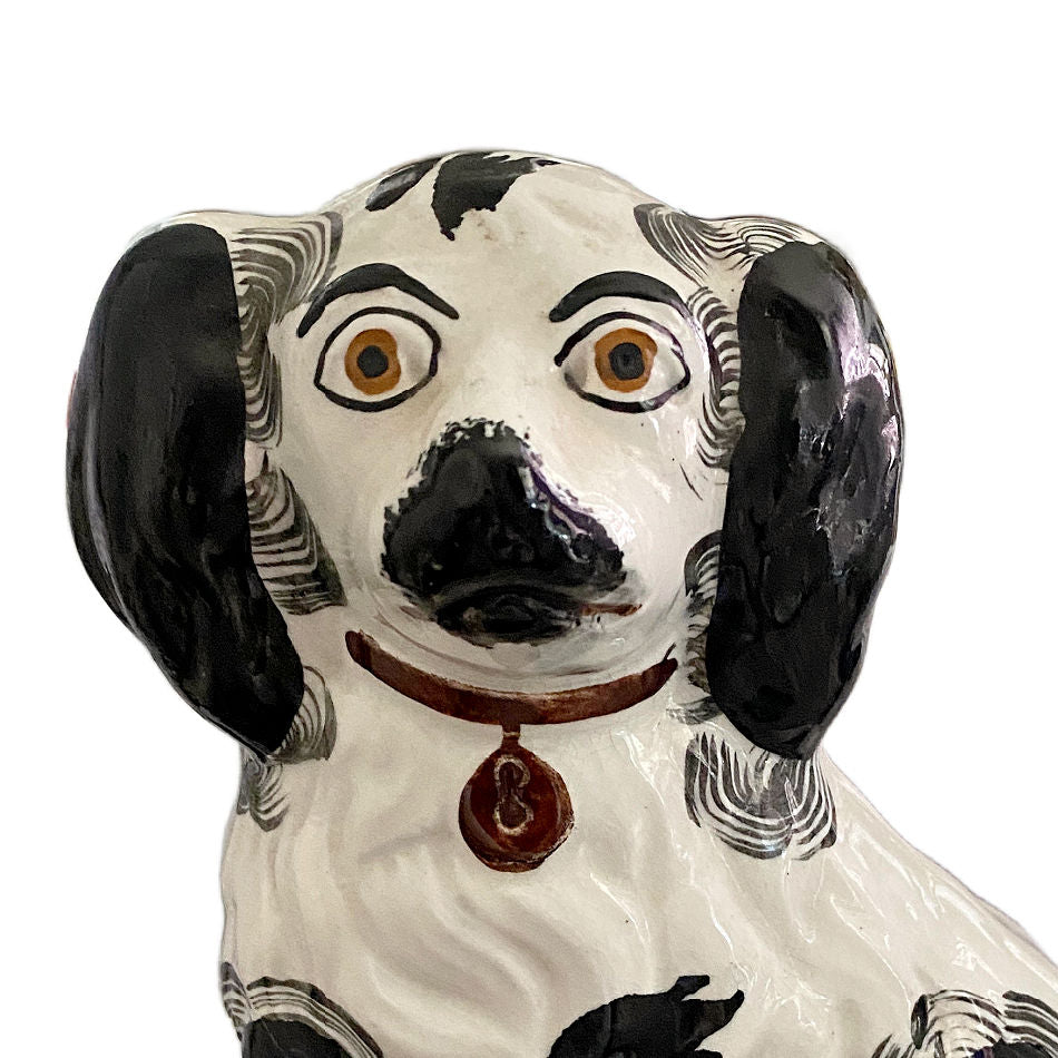 Antique black and white English spaniel dog figure face with wine lustre collar