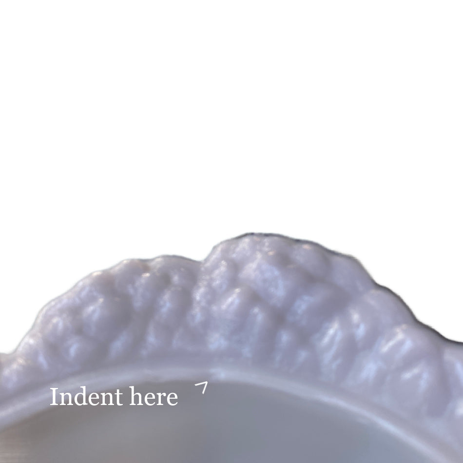 Side view of lilac opaline cabbage bowl highlighting sculpted cabbage leaf form and luminous glass finish close up