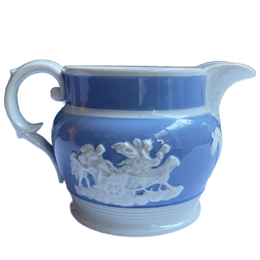 Antique English Staffordshire pearlware jug by Chetham & Woolley, c.1820–30, with classical jasperware-style relief figures. 5 inches high.