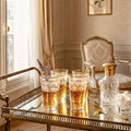 French gilt crystal glasses Louis XVI revival small elegant form on gold bar cart