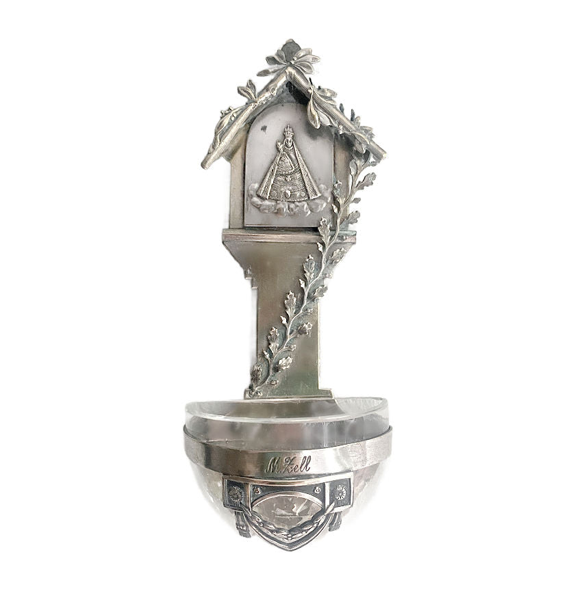 Antique silvered Mariazell pilgrimage virgin mary holy water font souvenir, featuring an embossed Madonna and Child surrounded by branches and leaf garlands.
