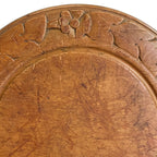 aged sycamore cutting board with floral detail and natural wear