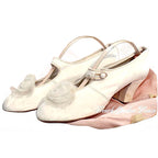 Rare antique white leather bridal shoes adorned with ethereal chiffon roses. Romantic historic wedding footwear, beautifully preserved.