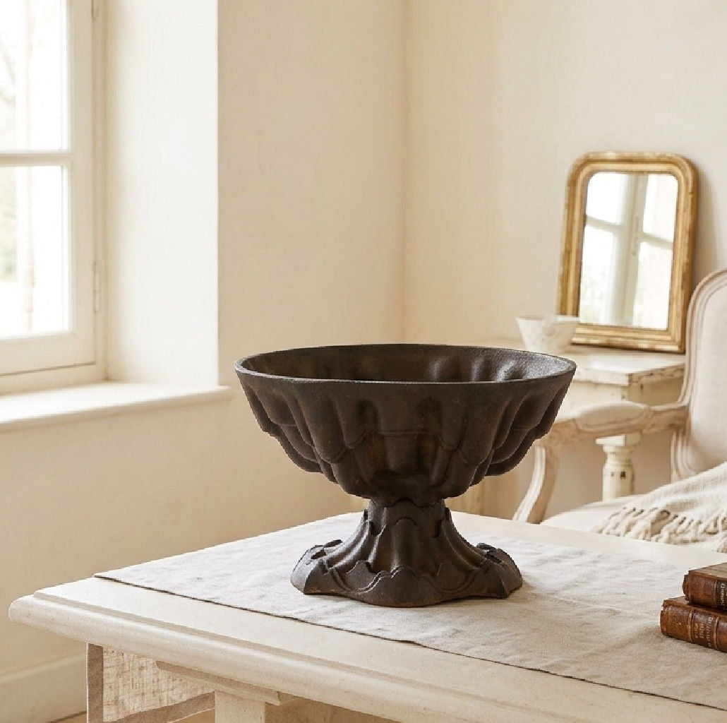 Victorian cast iron urn used as a decorative planter in a light-filled interior
