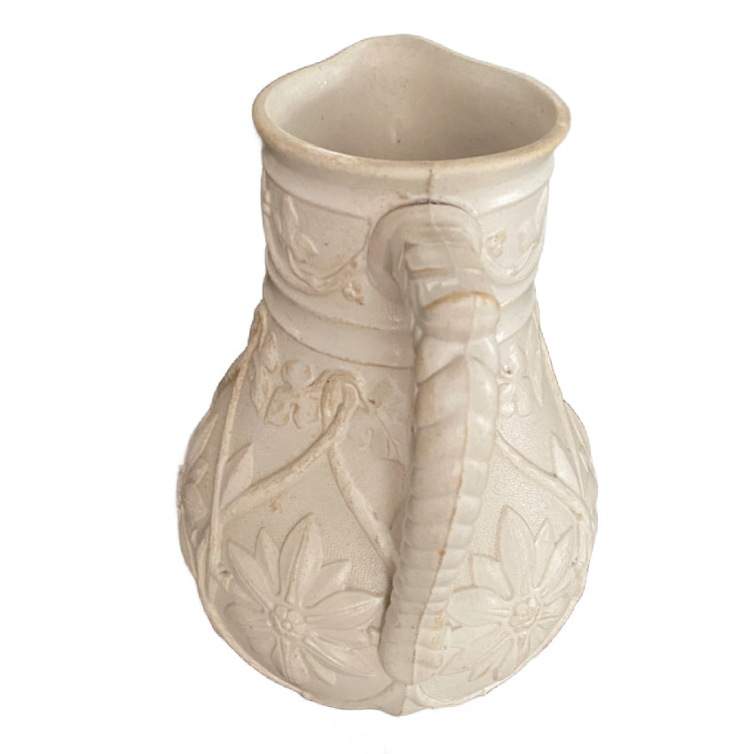 English Gothic revival relief molded pitcher with applied handle detail