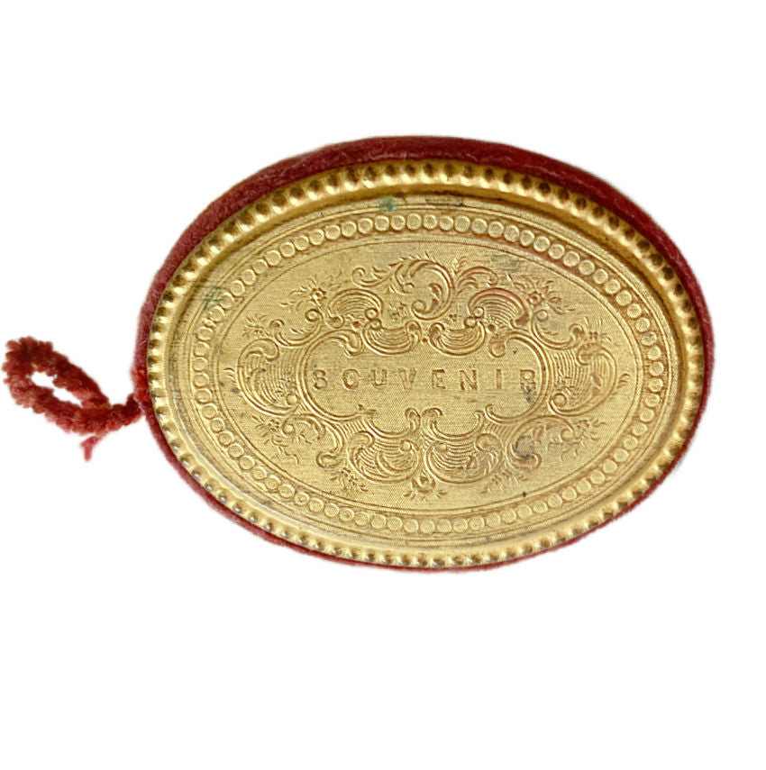 Close detail of Palais Royale gilt pin keeper inside Victorian sewing box