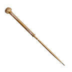 Elegant antique button hook by Apollo Studios showing gold-plated finish and enamel detail