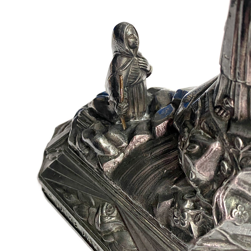Antique Notre Dame de Lourdes figure in dark metal with gold halo, 5¼ × 3½ × 7⅞ inches, collectible French religious art showing Bernadette
