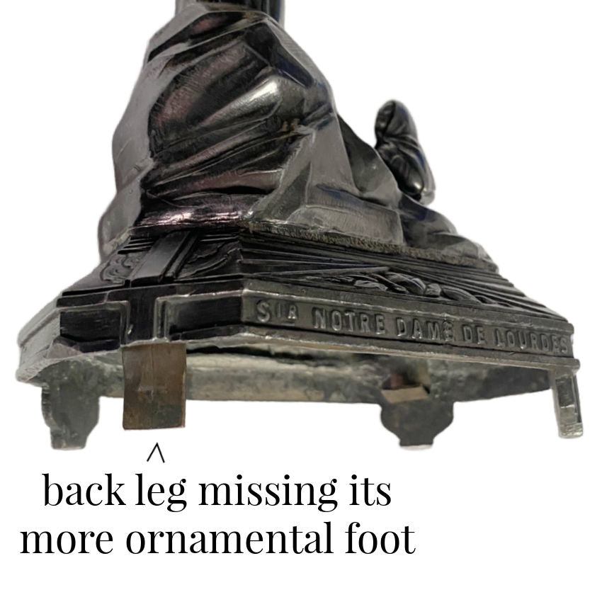 Antique Art Deco French Notre Dame de Lourdes Virgin Mary figure in dark metal with gilded halo and rose-adorned base signed  Notre Dame de Lourdes on base