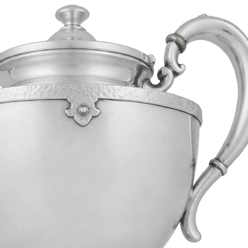 Antique Art Deco silver teapot with rounded body, long curved spout and stepped lid detail