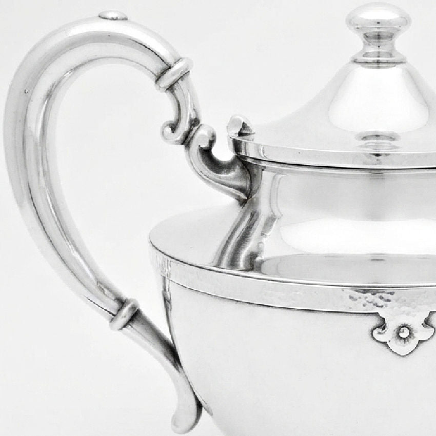 Antique Art Deco teapot in silver plate with graceful curved handle and spout