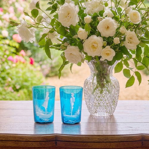 Antique turquoise Bohemian tumblers displayed in natural light