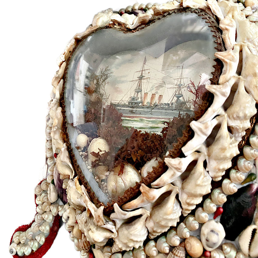 Intricate antique sailor’s valentine with steamship print