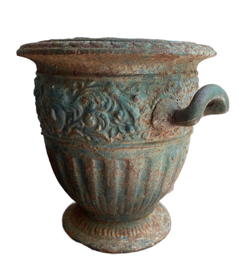 Antique cast iron garden urn with verdigris patina