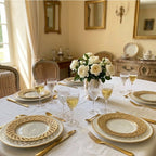 Antique French pierced porcelain plates by Pillivuyt displayed elegantly on a table in a French country interior