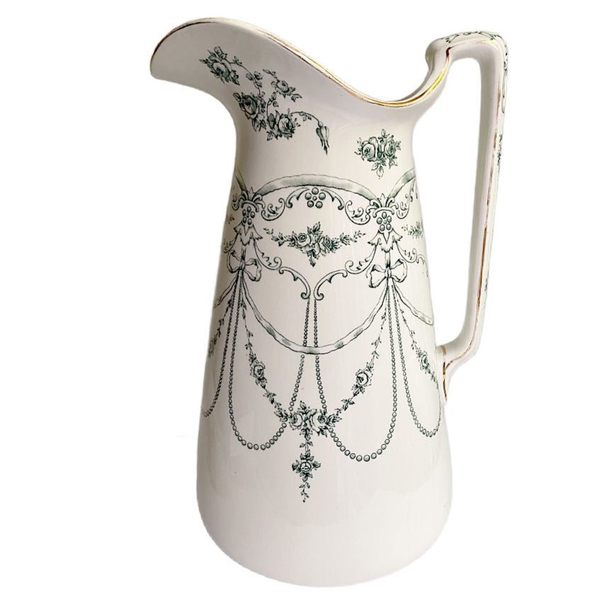 Side profile of John Maddock &amp; Sons Royal Ironstone Empire pattern pitcher with teal glaze and delicate rose motif, Victorian-era Staffordshire design.