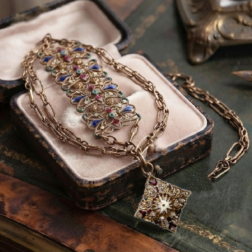 Antique filigree watch chain necklace with jewel-toned enamel in antique velvet jewelry box