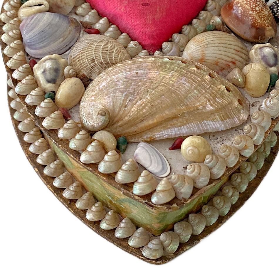 Close-up of abalone shell on antique English shellwork heart box
