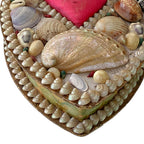 Close-up of abalone shell on antique English shellwork heart box