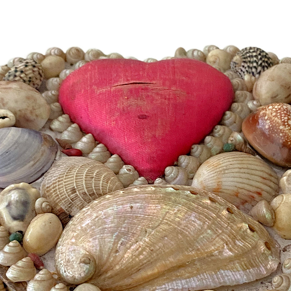 Glowing abalone shell detail on antique English souvenir box