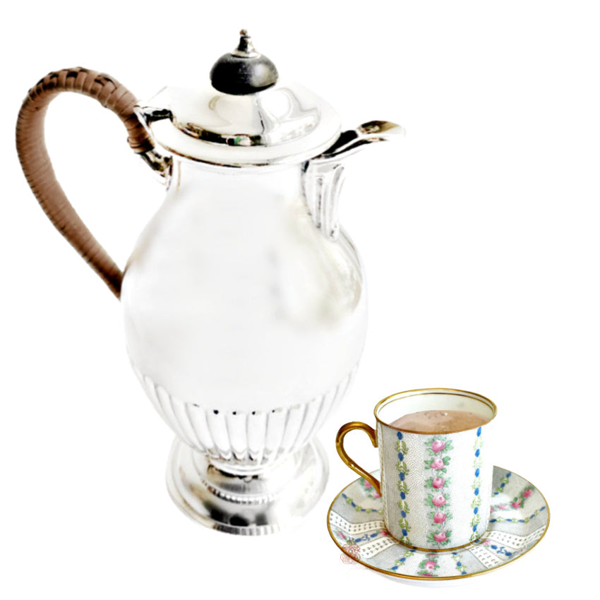 Antique English silver plate chocolate pot with small porcelain cup of hot chocolate elegant Edwardian chocolate service display