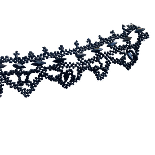 Antique French black glass beaded trim on wire, intricate jet-style lattice passementerie from the 19th century, ideal for couture, display, or textile art collections.