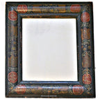 Antique folk art courting mirror with red tulips and black painted background