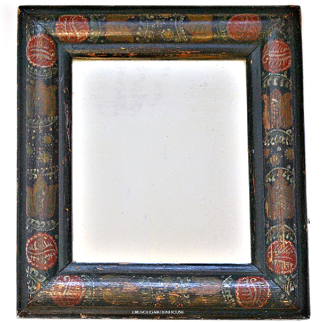 Antique folk art courting mirror with red tulips and black painted background