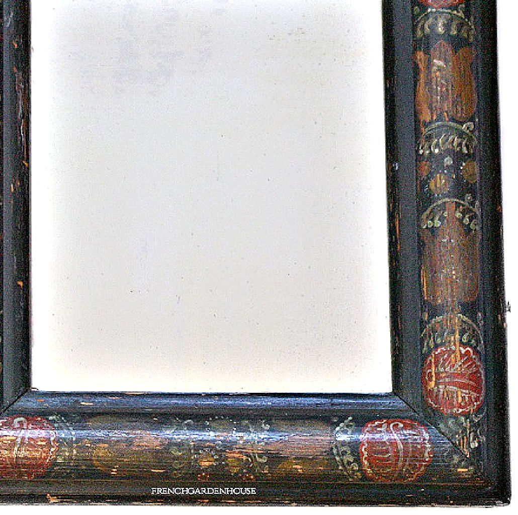 Antique courting mirror showing softly aged glass with subtle ghosting and patina