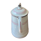 Antique French enamelware cafetière in white and pink with classic form, soft patina, and charming hand-painted details.