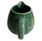 Antique French majolica pitcher with molded basketweave body handle
