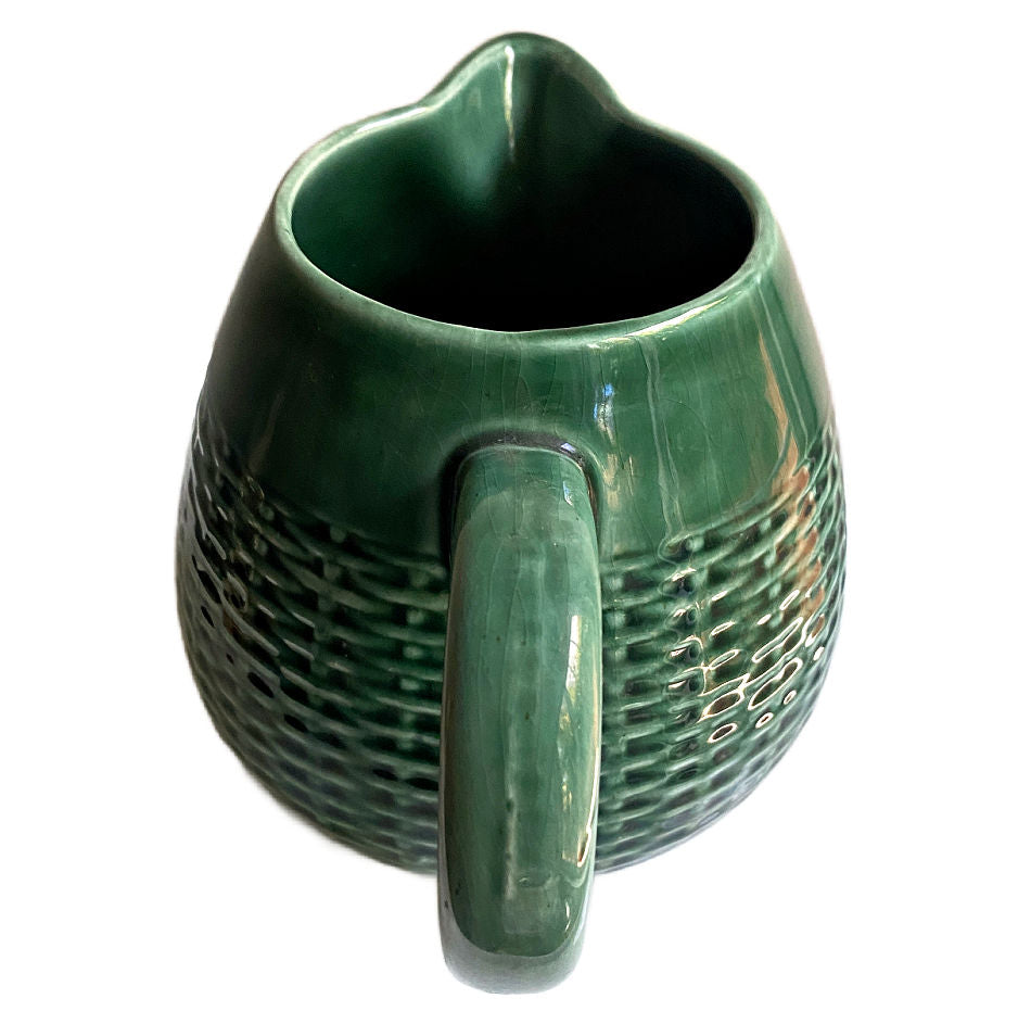 Antique French majolica pitcher with molded basketweave body handle