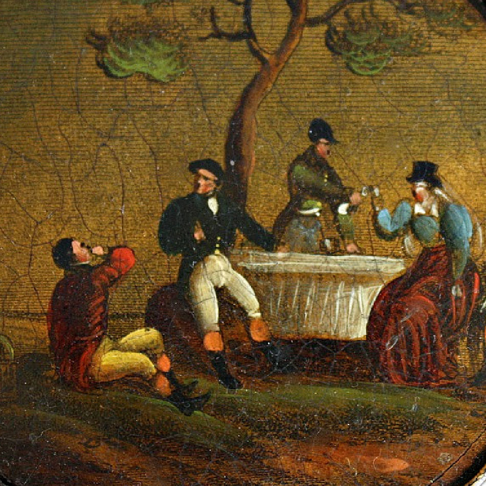 Close-up of antique French lacquer snuff box with figural scene