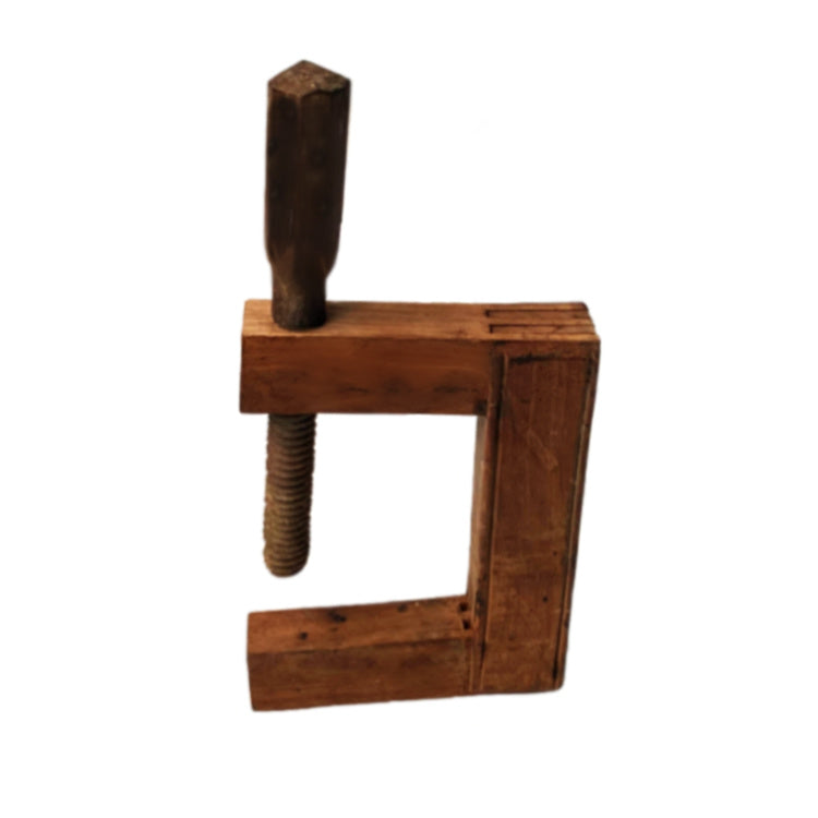 Antique French industrial salvage bench vise screw clamp, made of wood with a visible screw and vise, showing signs of wear and patina.