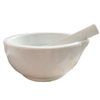 Side view of antique French ironstone mortar showing thick walls and sturdy porcelain pestle