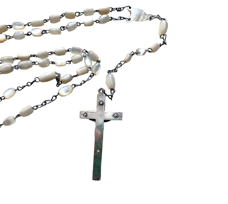Close up luminous mother of pearl rosary beads antique devotional jewelry