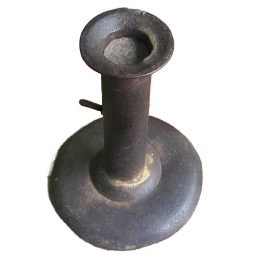 Antique French 19th century sheet iron push-up candlestick holder with visible seam, rounded base, and aged provincial patina. with lavender bundle