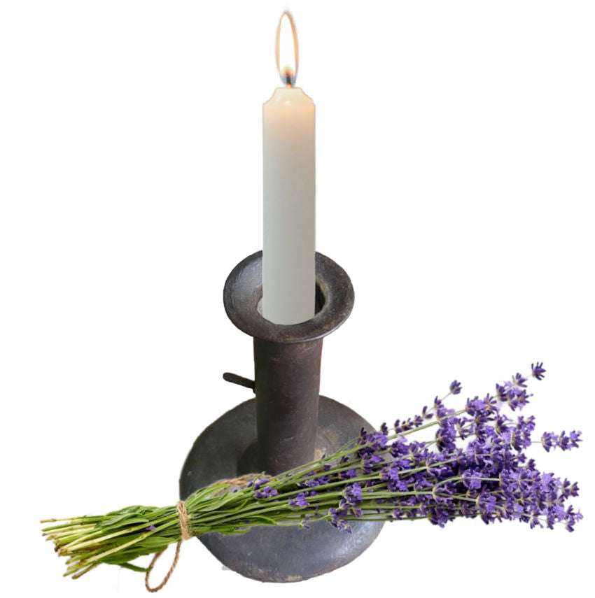 Antique French 19th century sheet iron push-up candlestick holder with visible seam, rounded base, and aged provincial patina. with lavender bundle