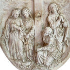 Close-up of pious women figures at foot of cross French plaster bas relief