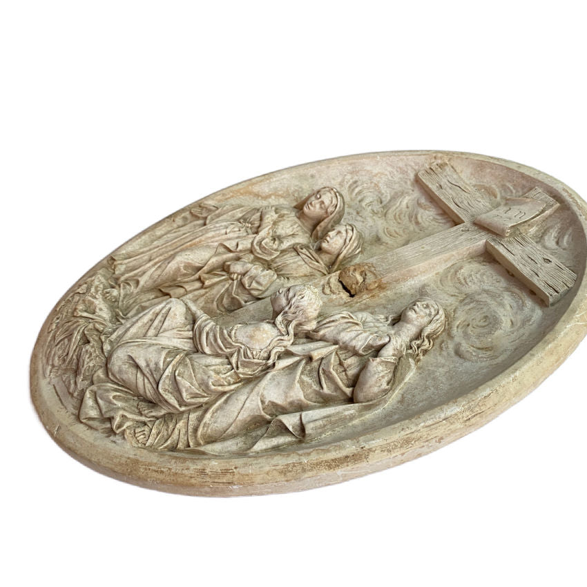 Side view showing depth and sculptural detail of plaster religious wall plaque