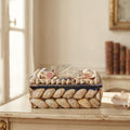 Antique French shell work box displayed with other treasured objects on a french desk