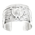 Antique French sterling silver cuff bracelet featuring an engraved heraldic shield and foliate design. Elegant, rare, and timeless.