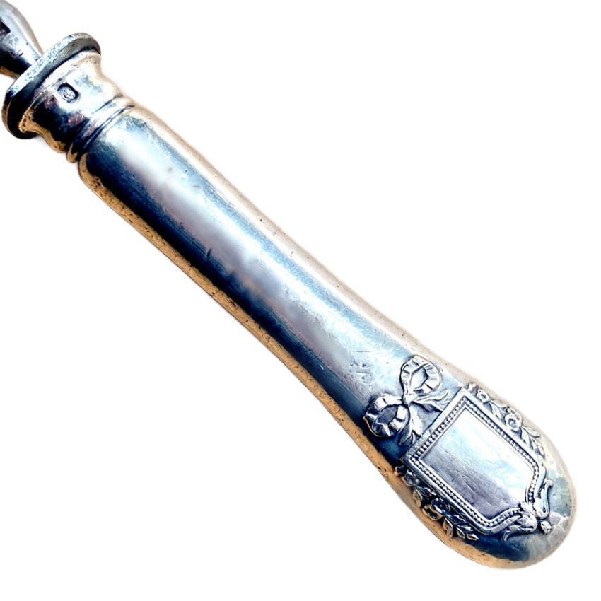 Antique French sterling silver meat serving fork with gilt stag and bow handle
