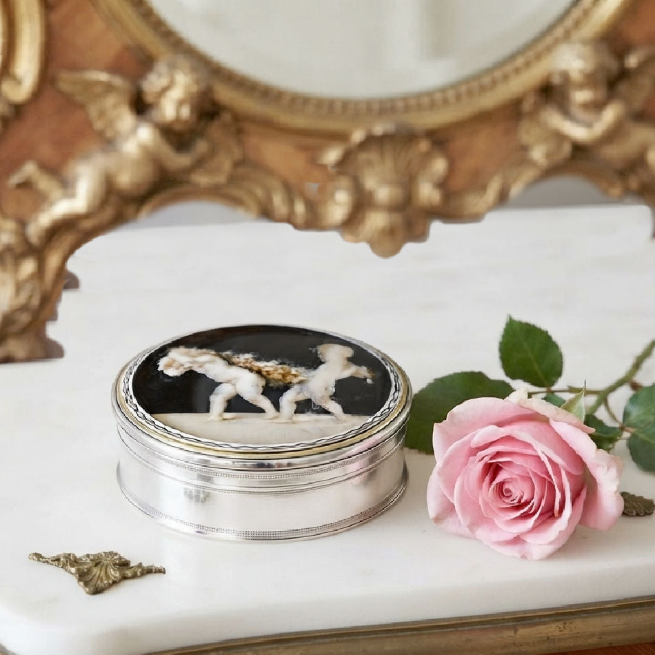 Antique French sterling silver snuff box with hand-painted cherubs styled on an antique French dresser