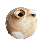 aged ceramic oil jug with natural glaze variations