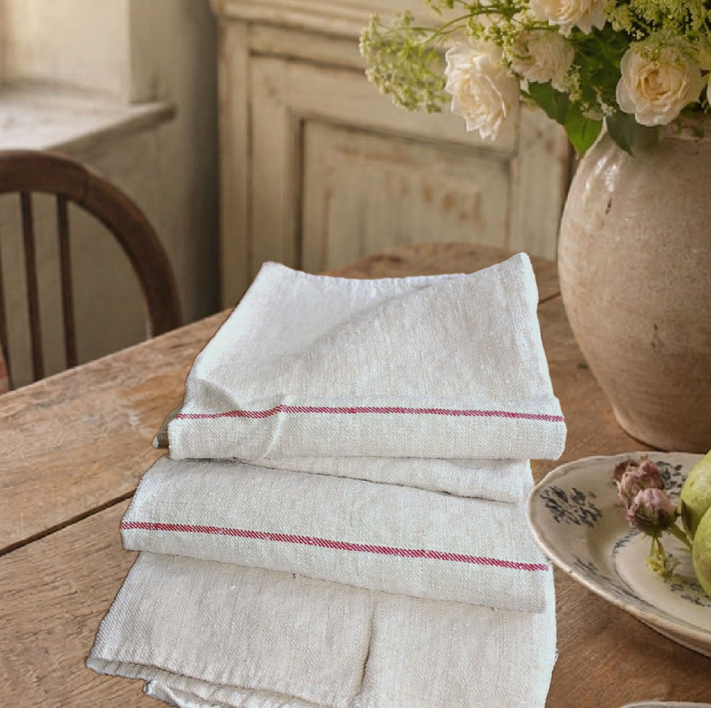 Antique French linen towel styled on a French country table setting