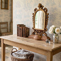 Elegant antique carved wood mirror with cherubs styled in soft French country décor