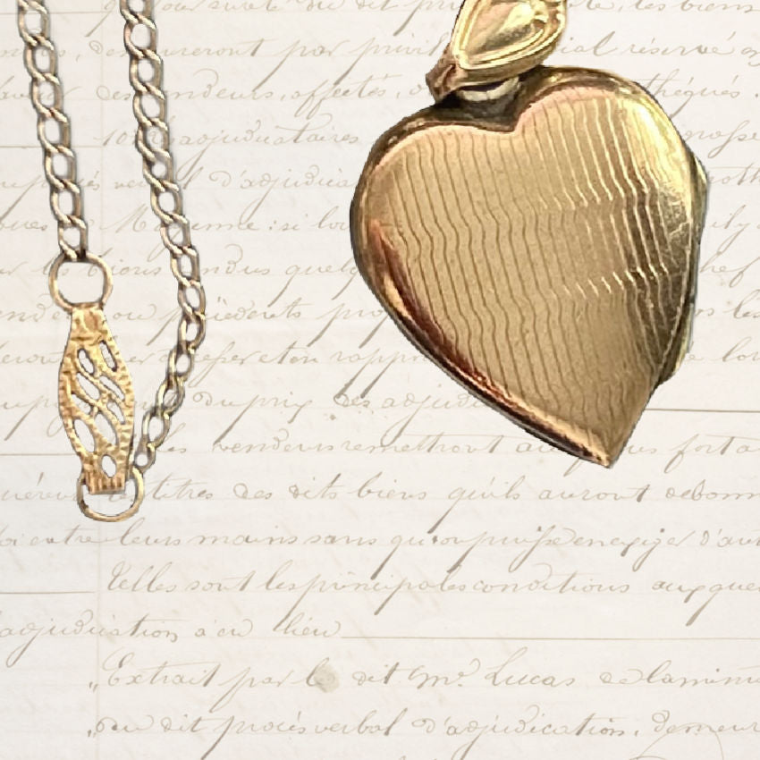 Back of antique gold-filled heart locket and closure