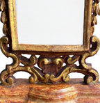 Antique decorative standing mirror with aged gold leaf and sculptural cherub design gilt rococo details