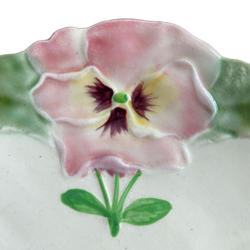 Close up French antique majolica pansy plate rich glaze Hautin Boulenger